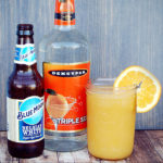Blue Moon beer, Triple Sec and orange juice in a mason jar with an orange slice