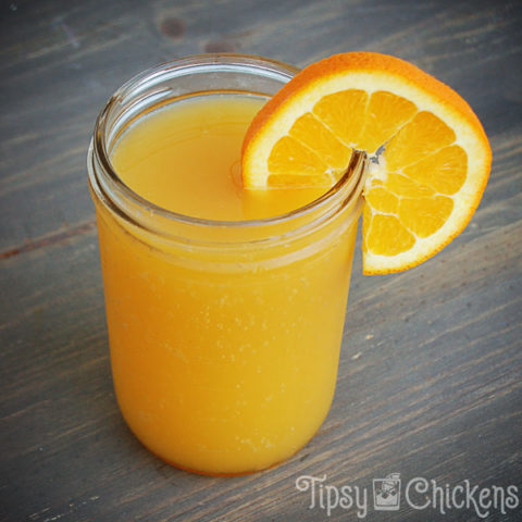 beer, triple sec & orange juice in a mason jar with an orange slice