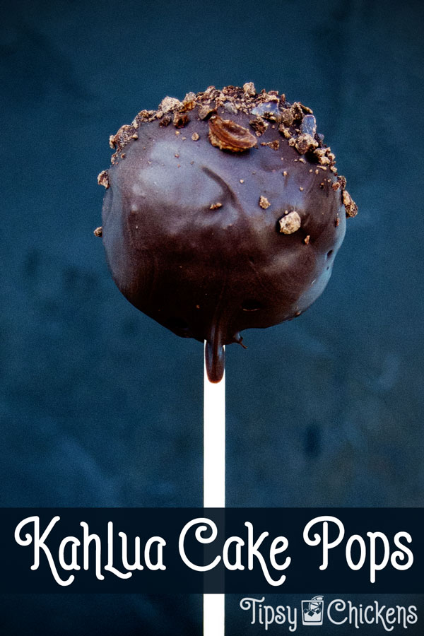 chocolate Kahlua cake pop covered in chocolate and topped with crushed chocolate covered coffee beans on a white stick