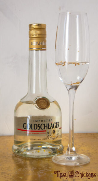 Goldschlager, triple sec and golf leaf in a champagne glass