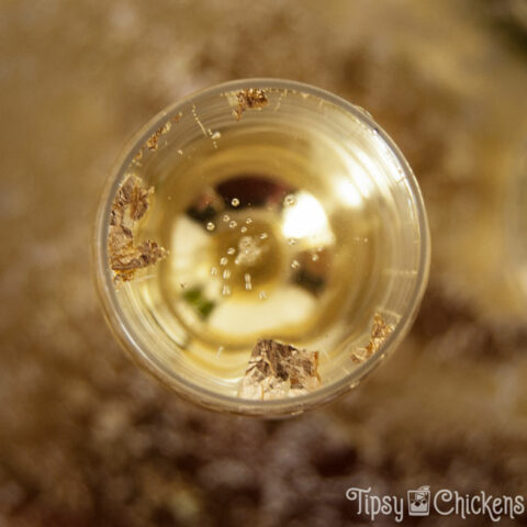 top view of champagne flute filled with champagne, triple sec and goldschlager