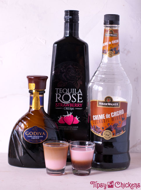 chocolate liqueurs layered with tequila rose in two shot glasses to show how different densities layer