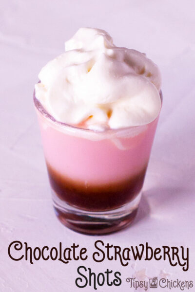 shot glass filled with tequila rose and chocolate liqueur topped with whipped cream